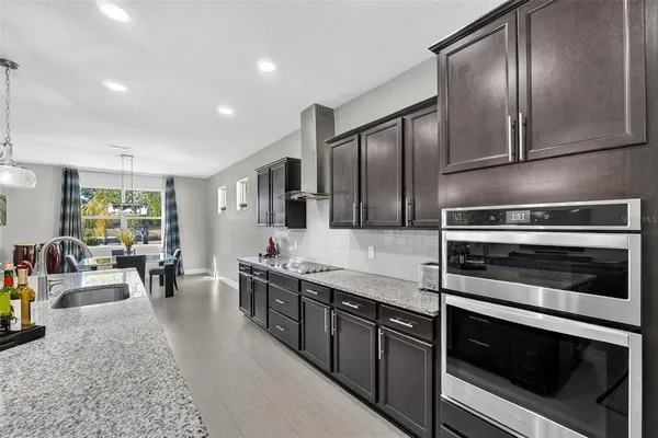 a bedroom with a bed and a potted plant