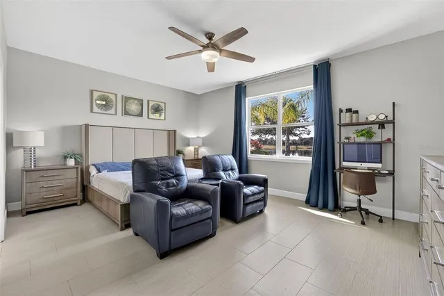 an aerial view of a house with a yard and swimming pool