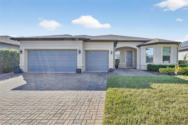 a view of a room with wooden floor and mirror
