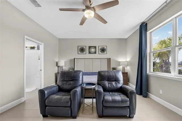 an aerial view of a house with a garden and lake view