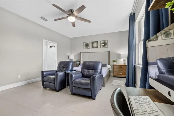 a aerial view of a house with a garden and lake view
