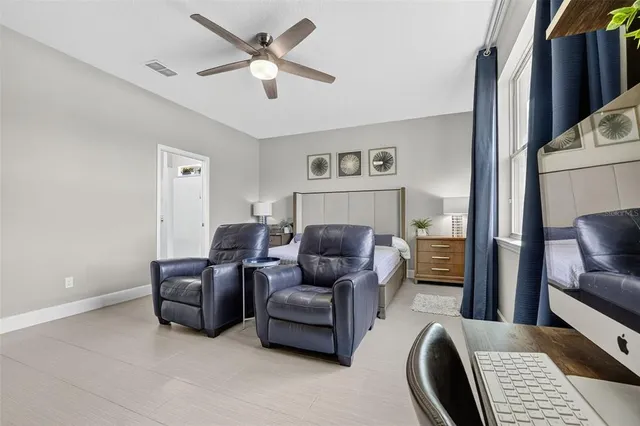 a aerial view of a house with a garden and lake view