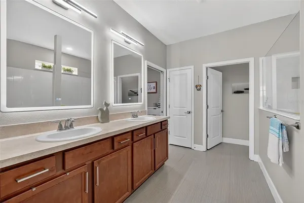 an aerial view of residential houses with outdoor space and river