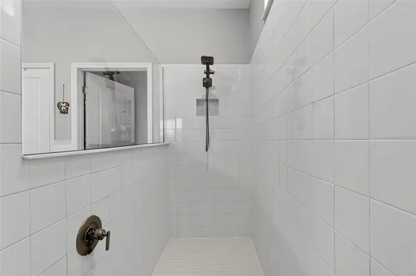 an aerial view of residential houses with outdoor space and river