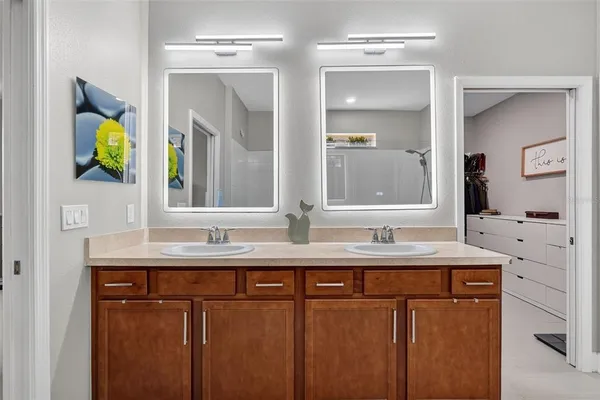 an aerial view of residential houses with outdoor space and lake view