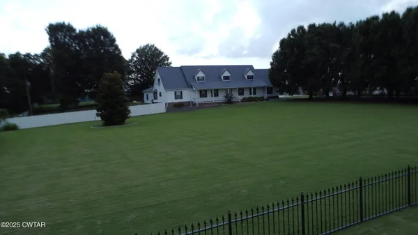 a view of a house with a big yard