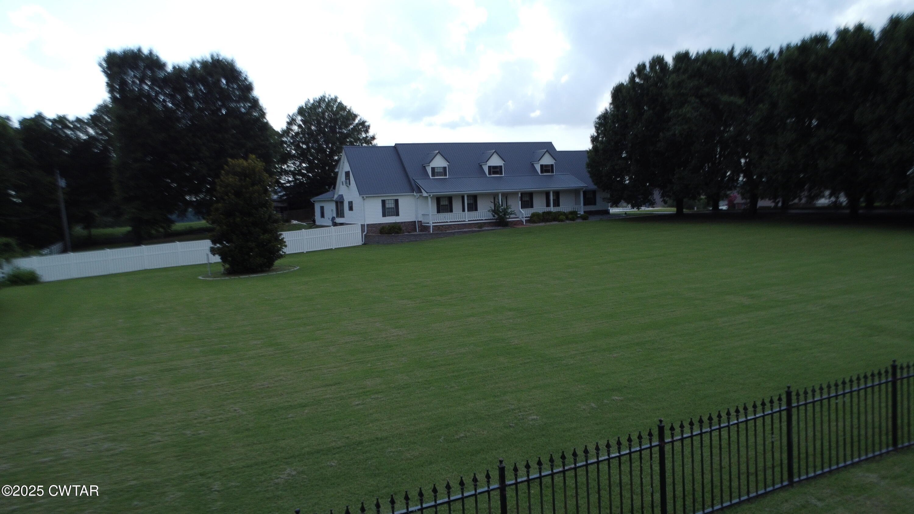 a view of a house with a big yard