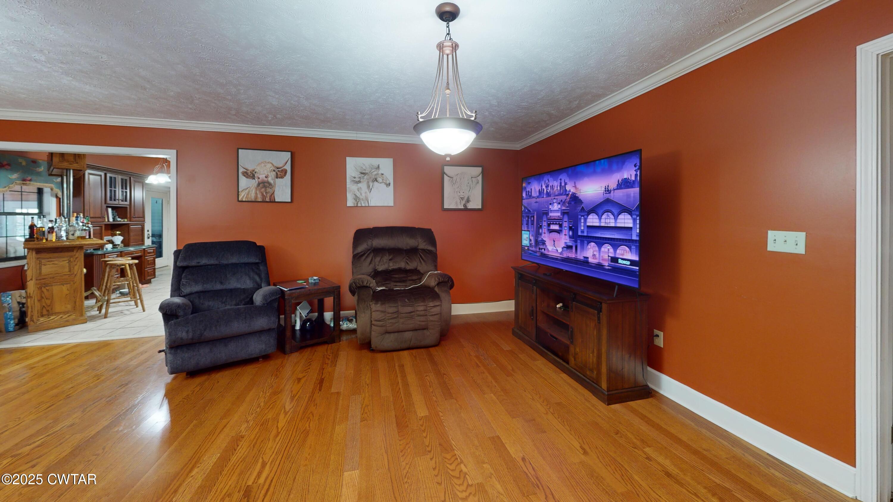 783 Sharps Ferry Road Newbern, TN 38059 - Photo 11 of 50 a living room with furniture and a flat screen tv