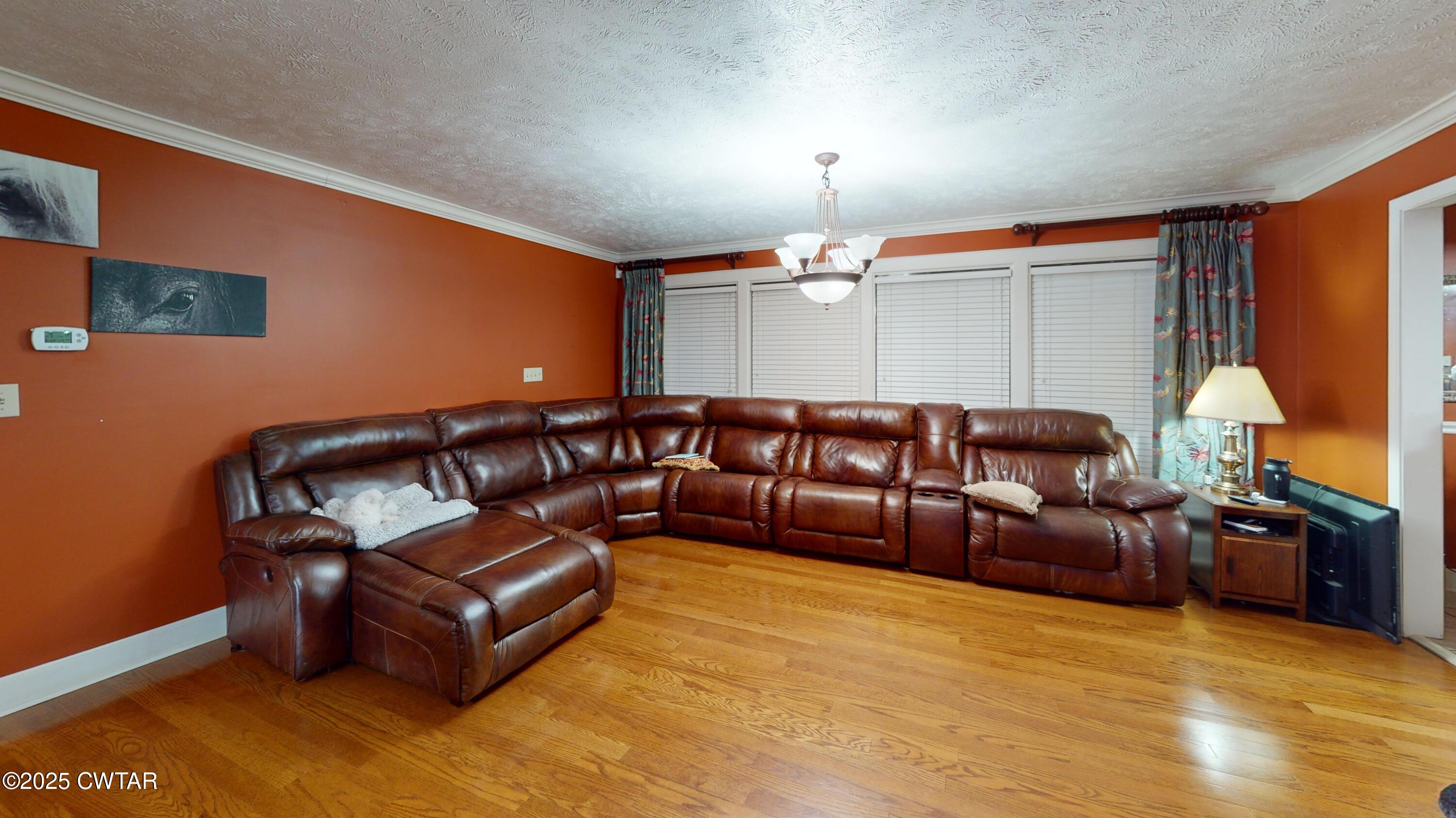 783 Sharps Ferry Road Newbern, TN 38059 - Photo 13 of 50 a living room with furniture and a lamp