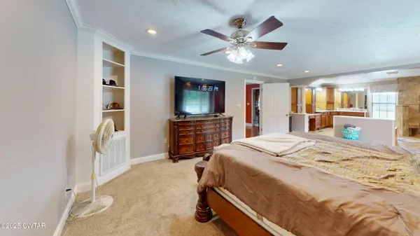 a spacious bathroom with a double vanity sink and a mirror