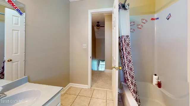 a bathroom with a bathtub and shower