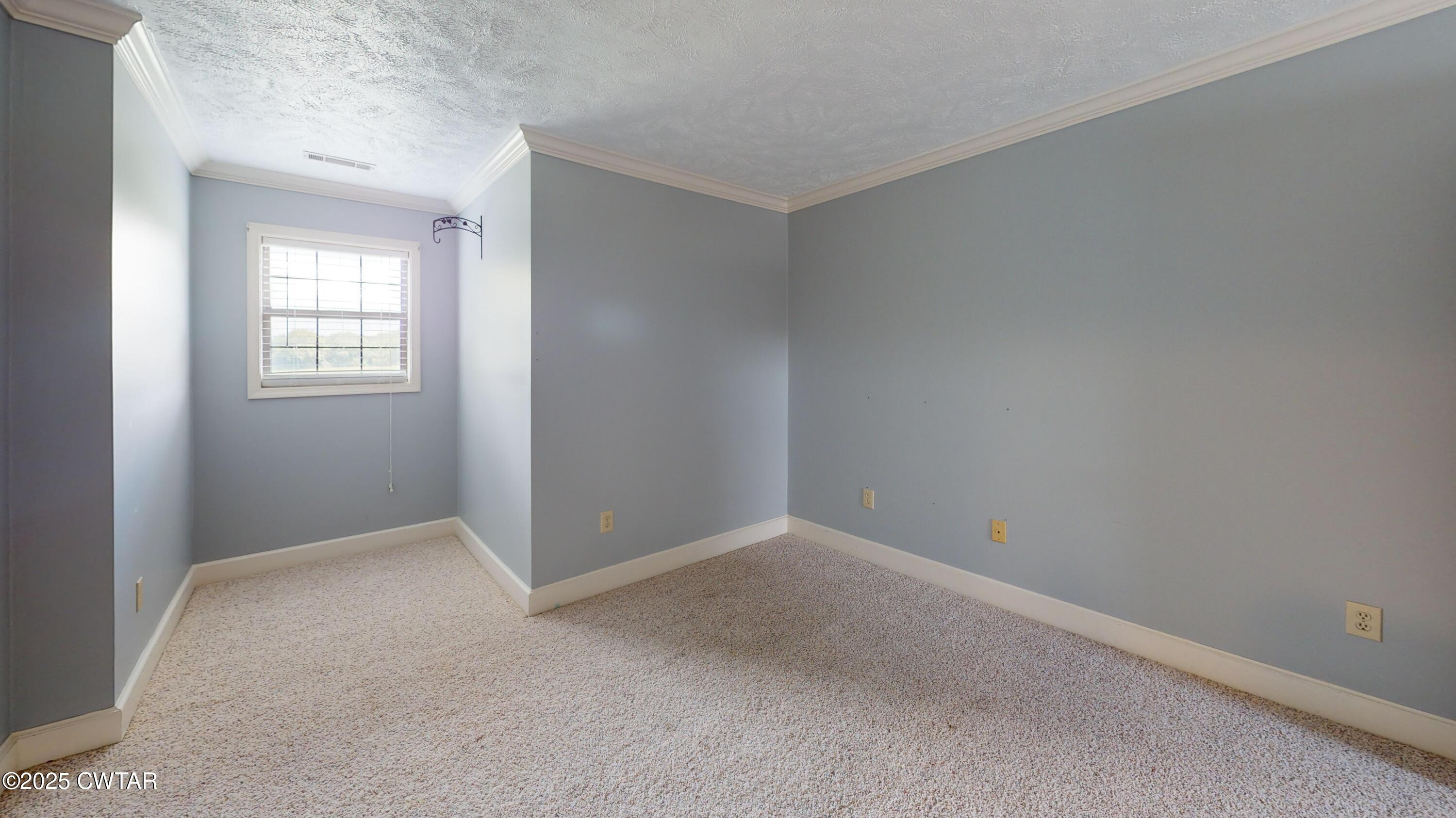 783 Sharps Ferry Road Newbern, TN 38059 - Photo 30 of 50 a view of an empty room with closet and a window