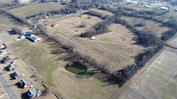 a view of a room with an empty space and window