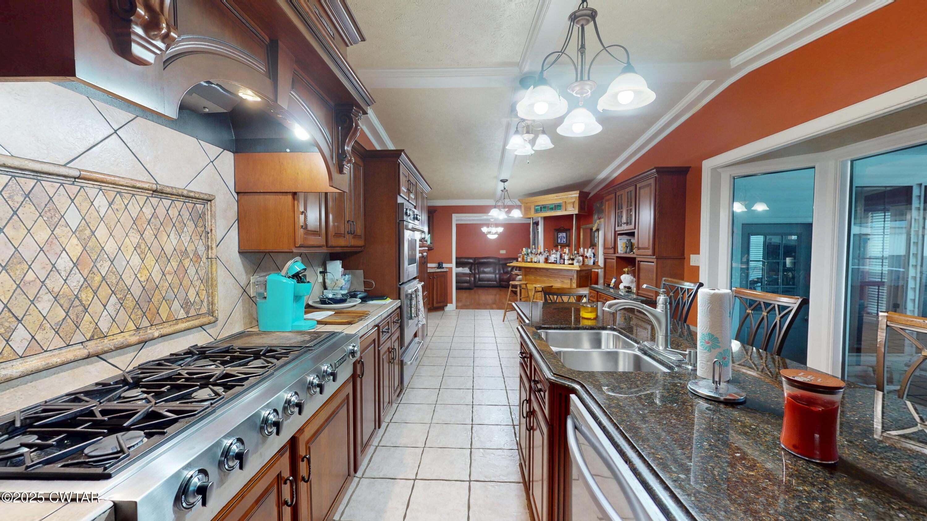 783 Sharps Ferry Road Newbern, TN 38059 - Photo 9 of 50 a kitchen with lots of counter top space and wooden floor