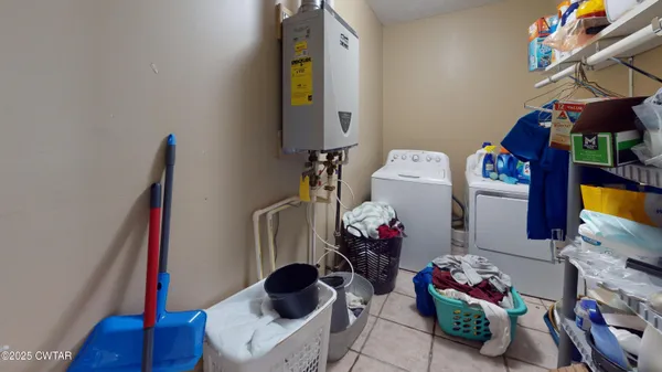 a bedroom with furniture and a flat screen tv