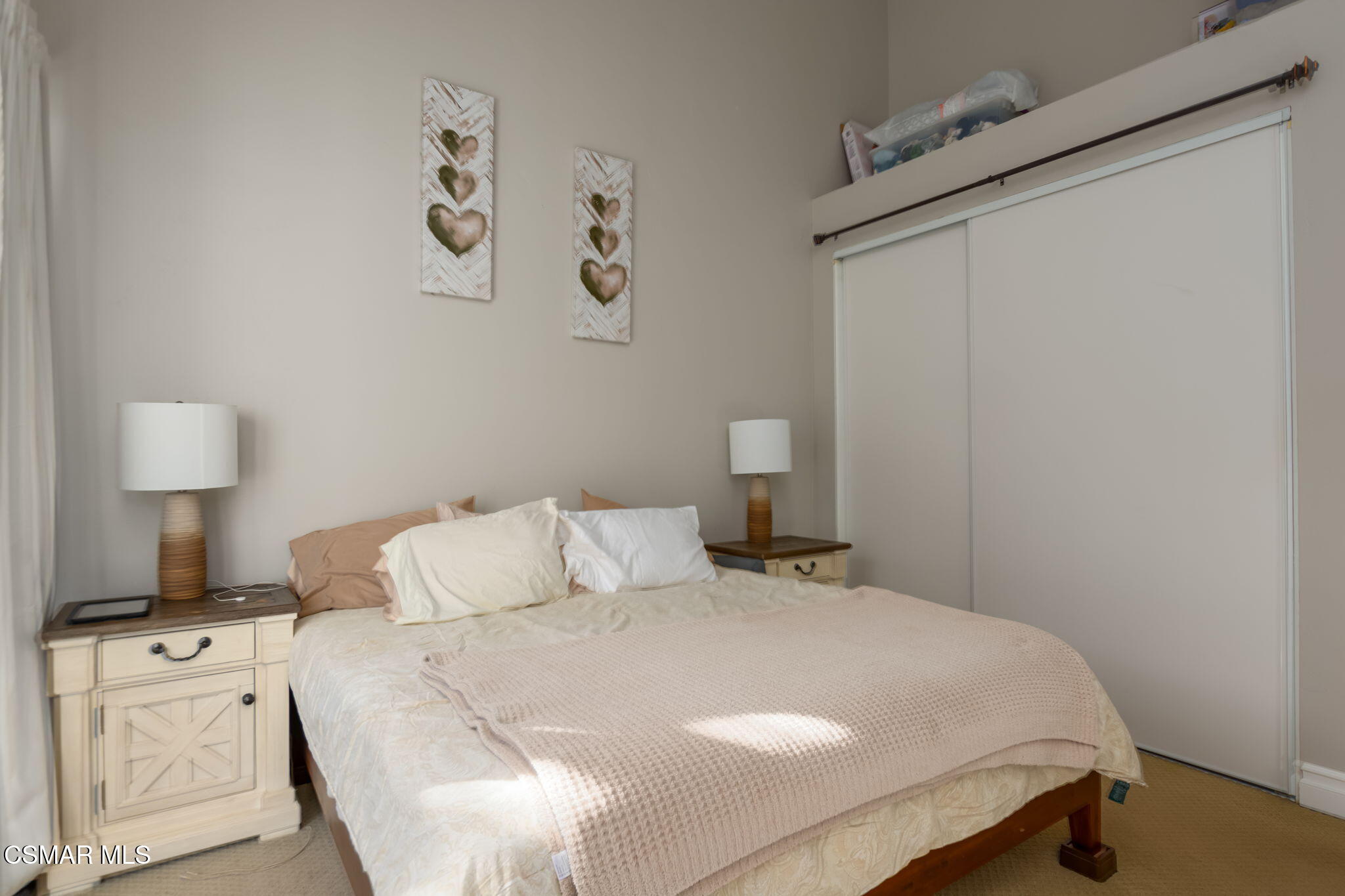 785 Arneill Road, Unit 47 Camarillo, CA 93010 - Photo 17 of 25 a bedroom with a bed and a lamp on the dresser