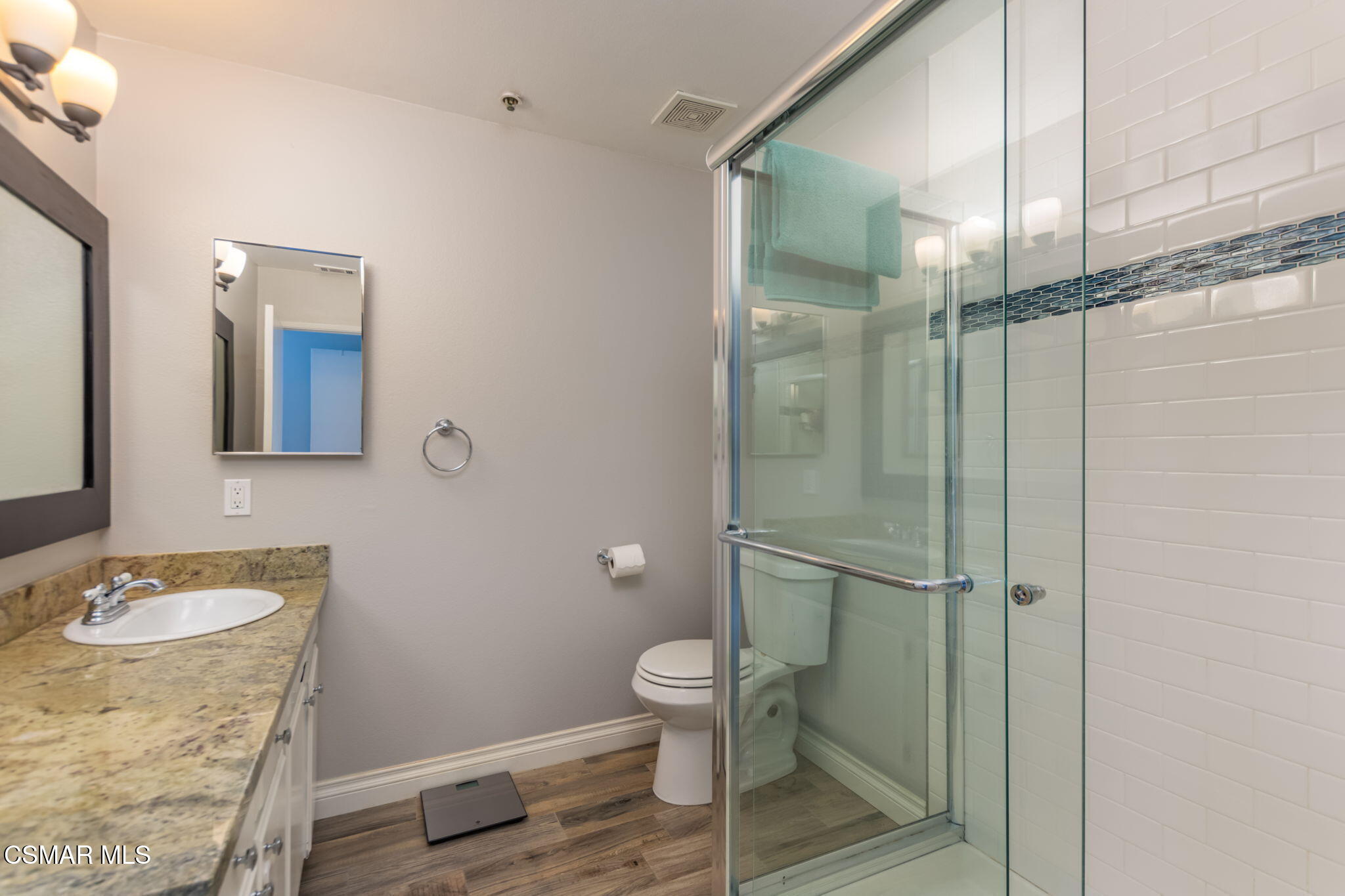 785 Arneill Road, Unit 47 Camarillo, CA 93010 - Photo 20 of 25 a bathroom with a granite countertop sink toilet and shower