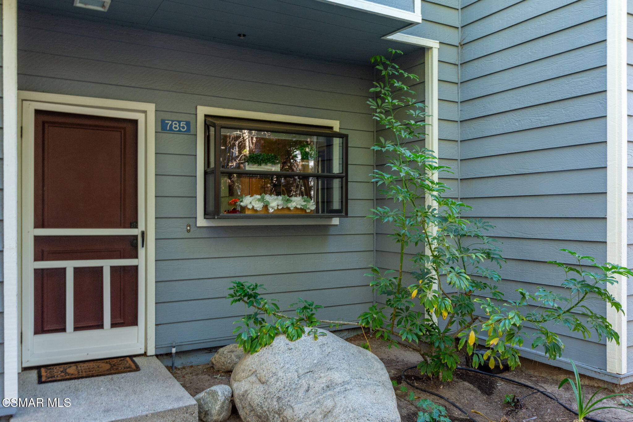 785 Arneill Road, Unit 47 Camarillo, CA 93010 - Photo 2 of 25 a couple of potted plants in front of door