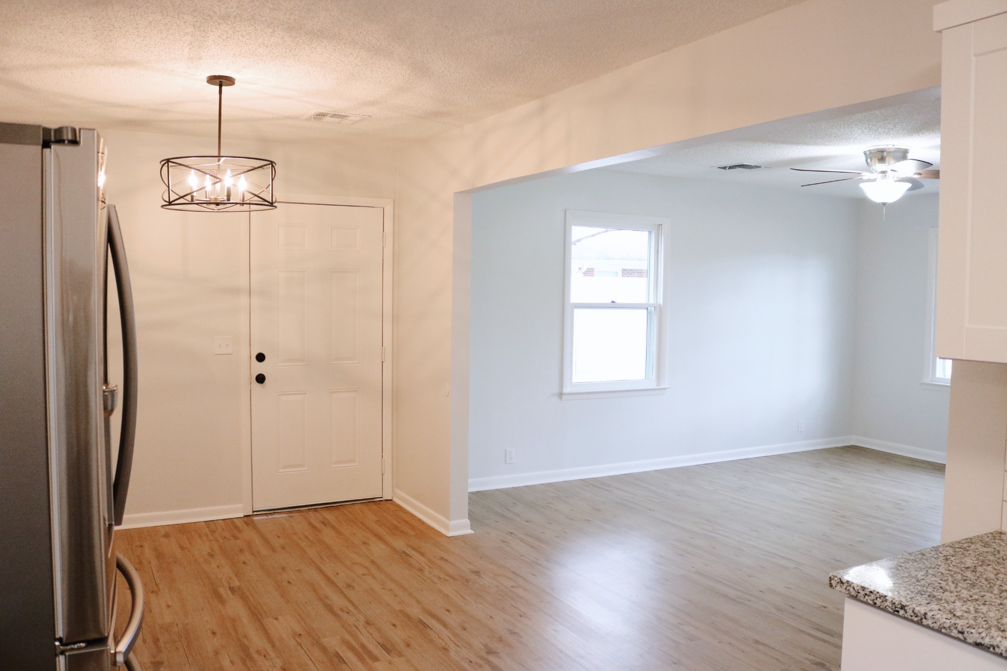 3322 Fann Road Murfreesboro, TN 37128 - Photo 13 of 29 an empty room with wooden floor cabinet and windows