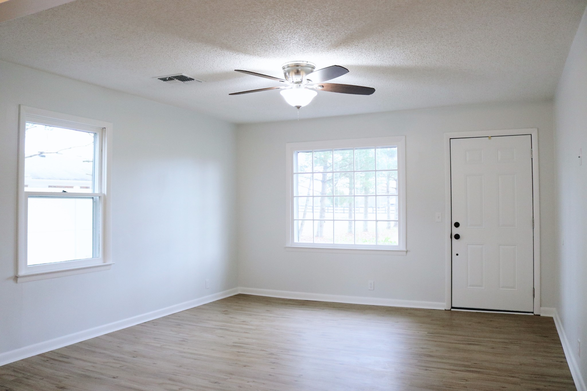 3322 Fann Road Murfreesboro, TN 37128 - Photo 15 of 29 a view of an empty room with wooden floor and a window