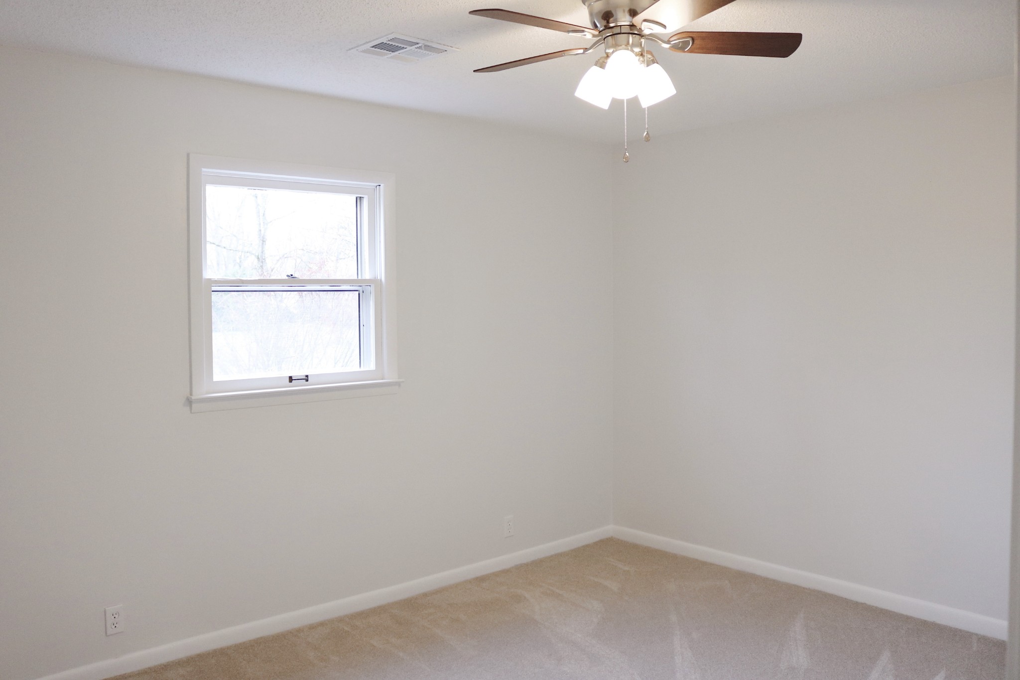 3322 Fann Road Murfreesboro, TN 37128 - Photo 26 of 29 an empty room with a window and a fan
