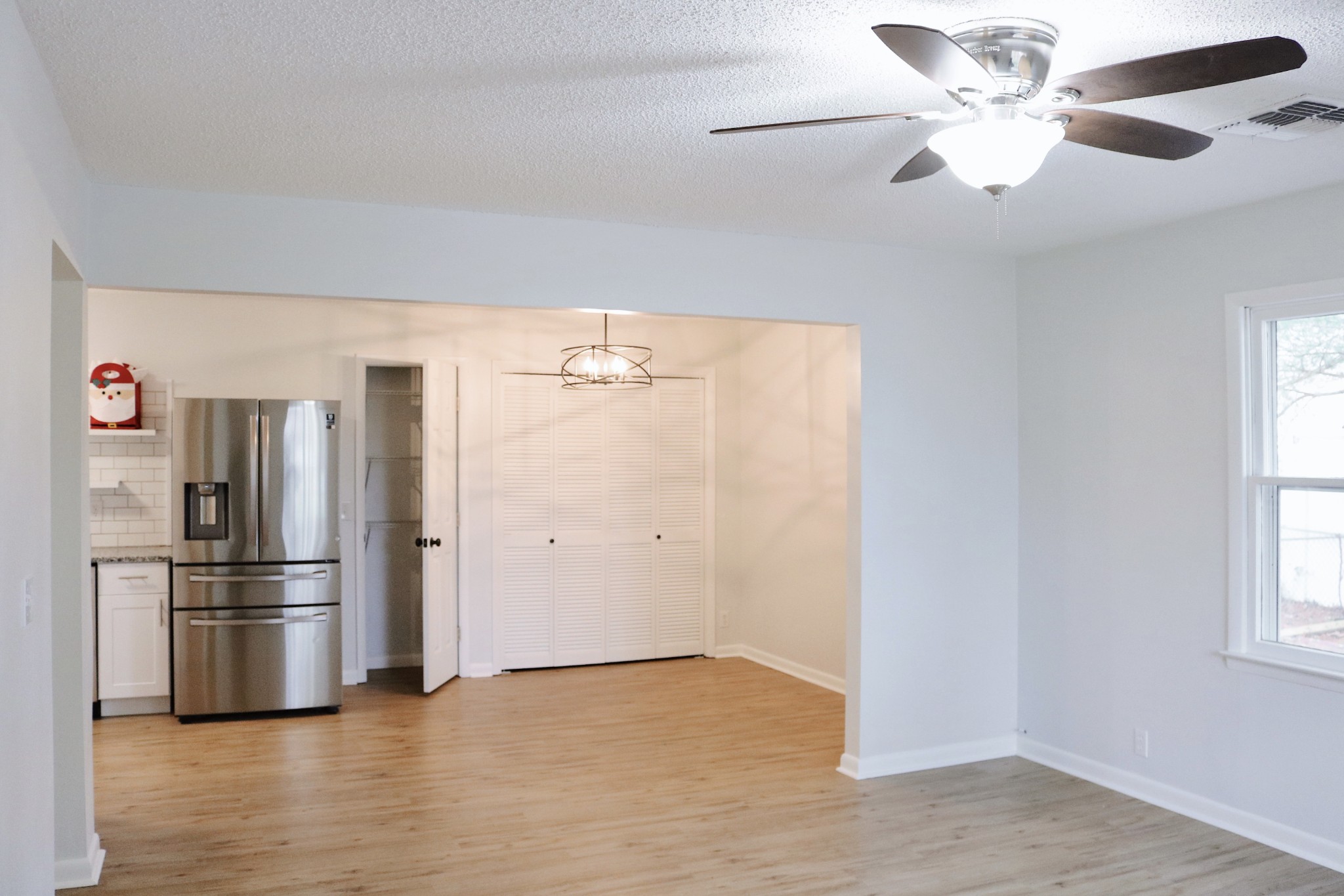 3322 Fann Road Murfreesboro, TN 37128 - Photo 9 of 29 a kitchen with stainless steel appliances a refrigerator and a chandelier