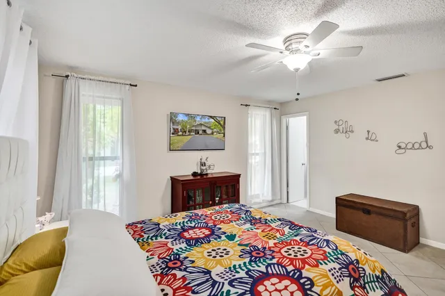 a bedroom with a bed and a television