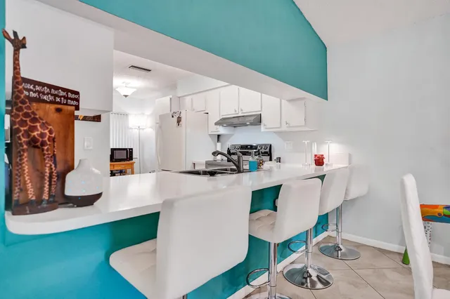 a kitchen with stainless steel appliances granite countertop a stove and a sink