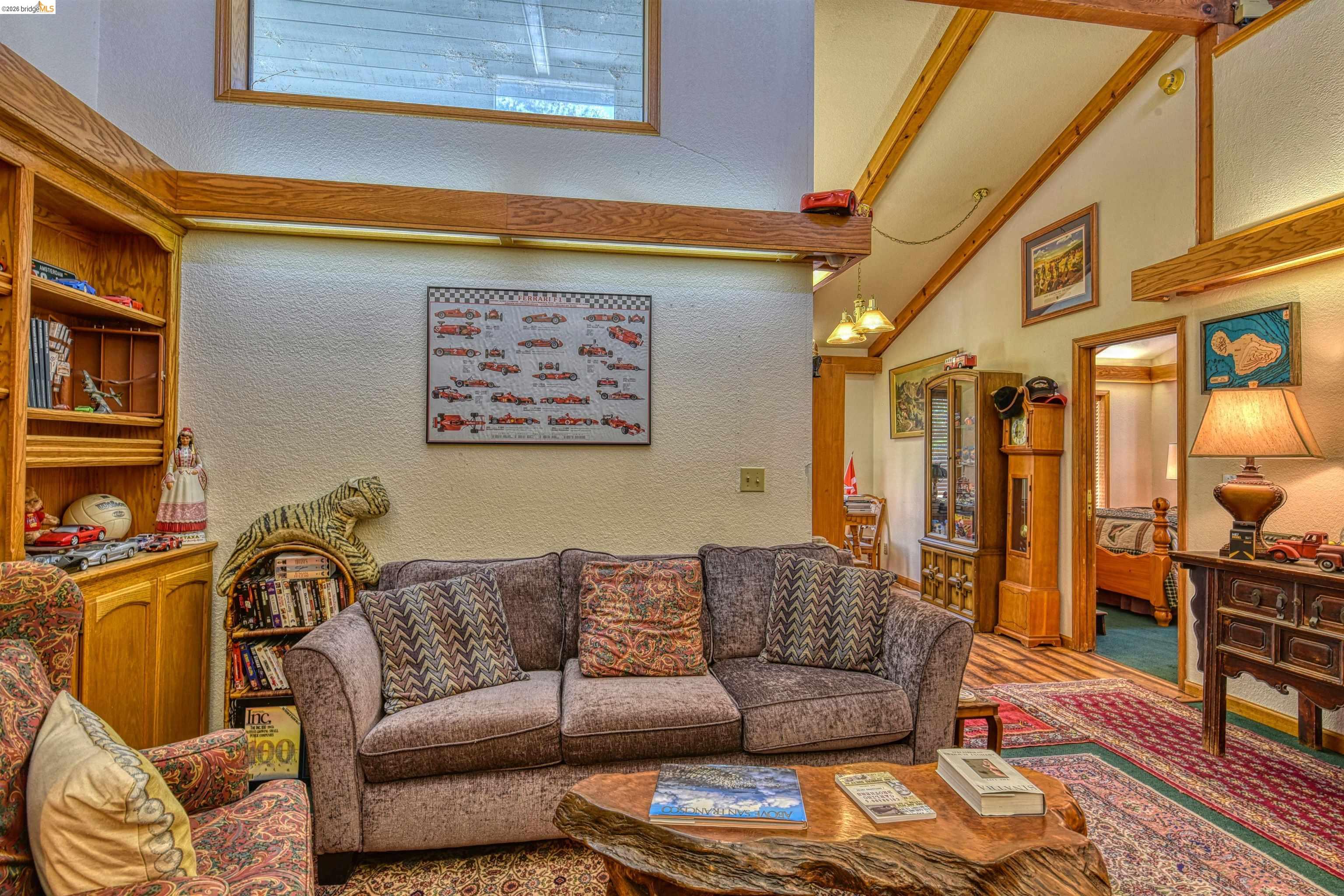 20950 Ferretti Road Groveland, CA 95321 - Photo 14 of 27 a blue couch sitting in front of a window