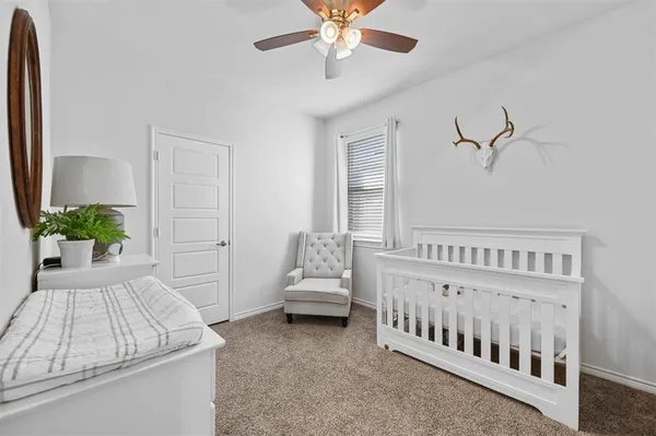 a bedroom with furniture and white walls