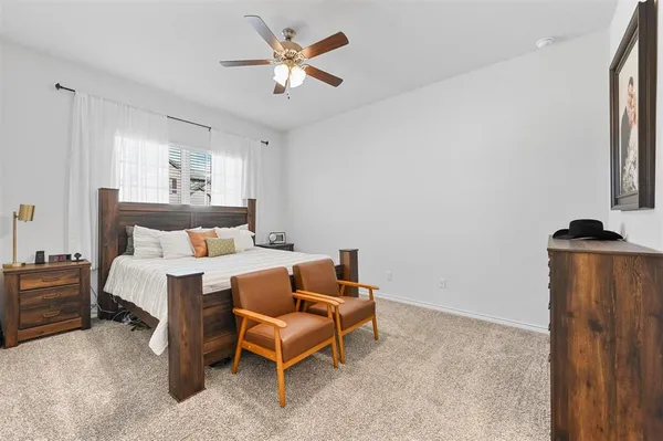 a bed room with a bed and a chandelier