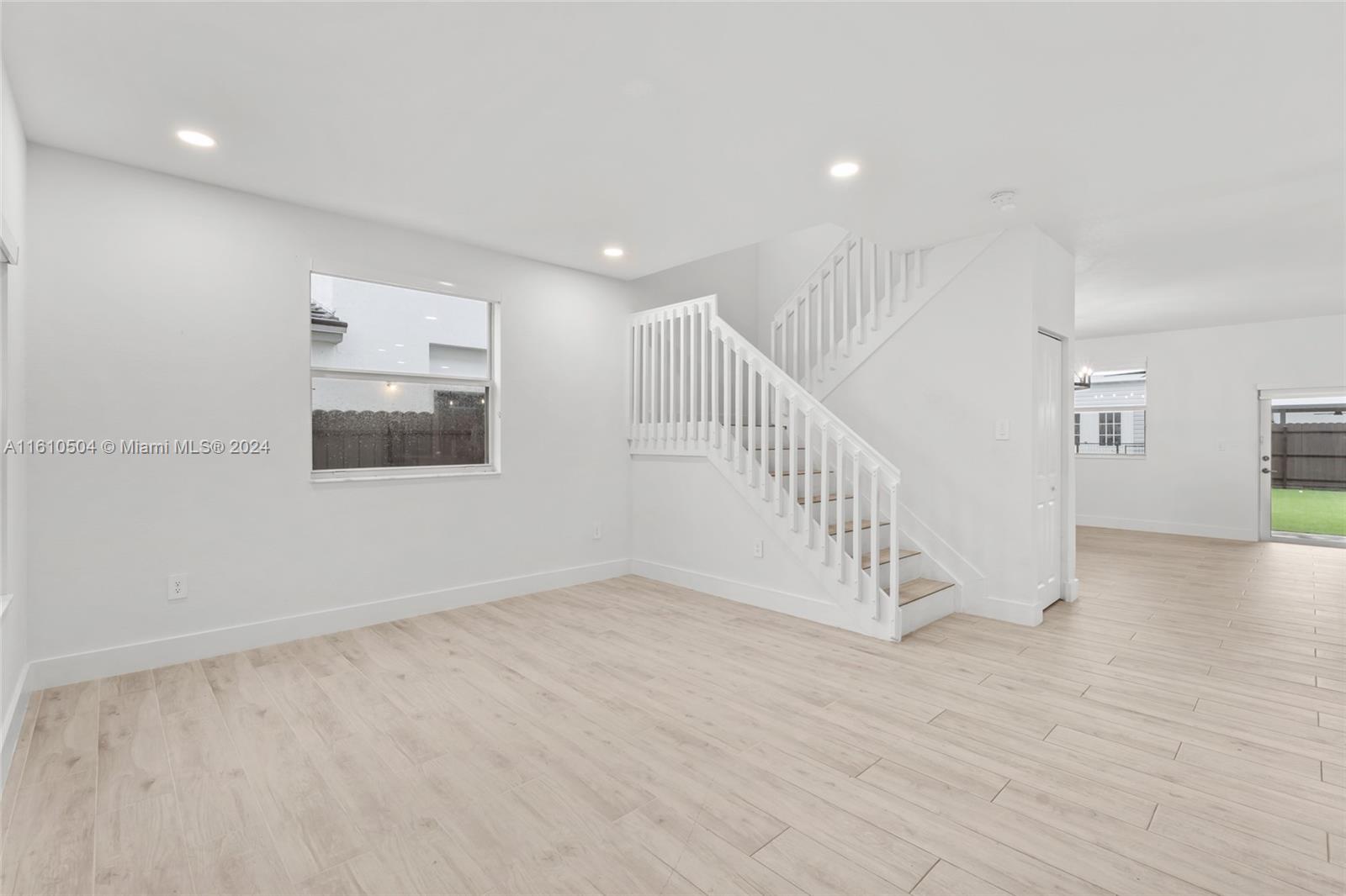 12743 Southwest 211th Street Miami, FL 33177 - Photo 11 of 38 a view of an entryway with wooden floor