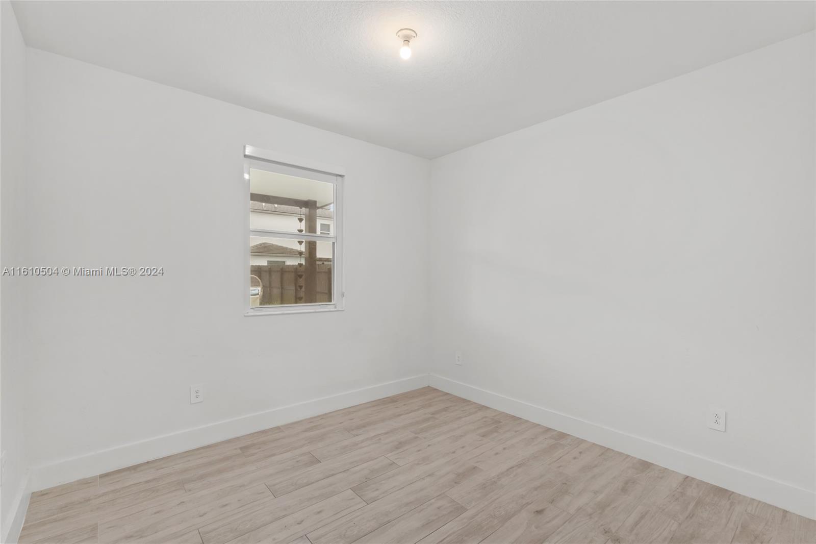 12743 Southwest 211th Street Miami, FL 33177 - Photo 18 of 38 wooden floor in an empty room