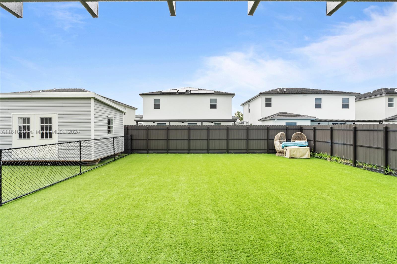 12743 Southwest 211th Street Miami, FL 33177 - Photo 34 of 38 a view of a backyard