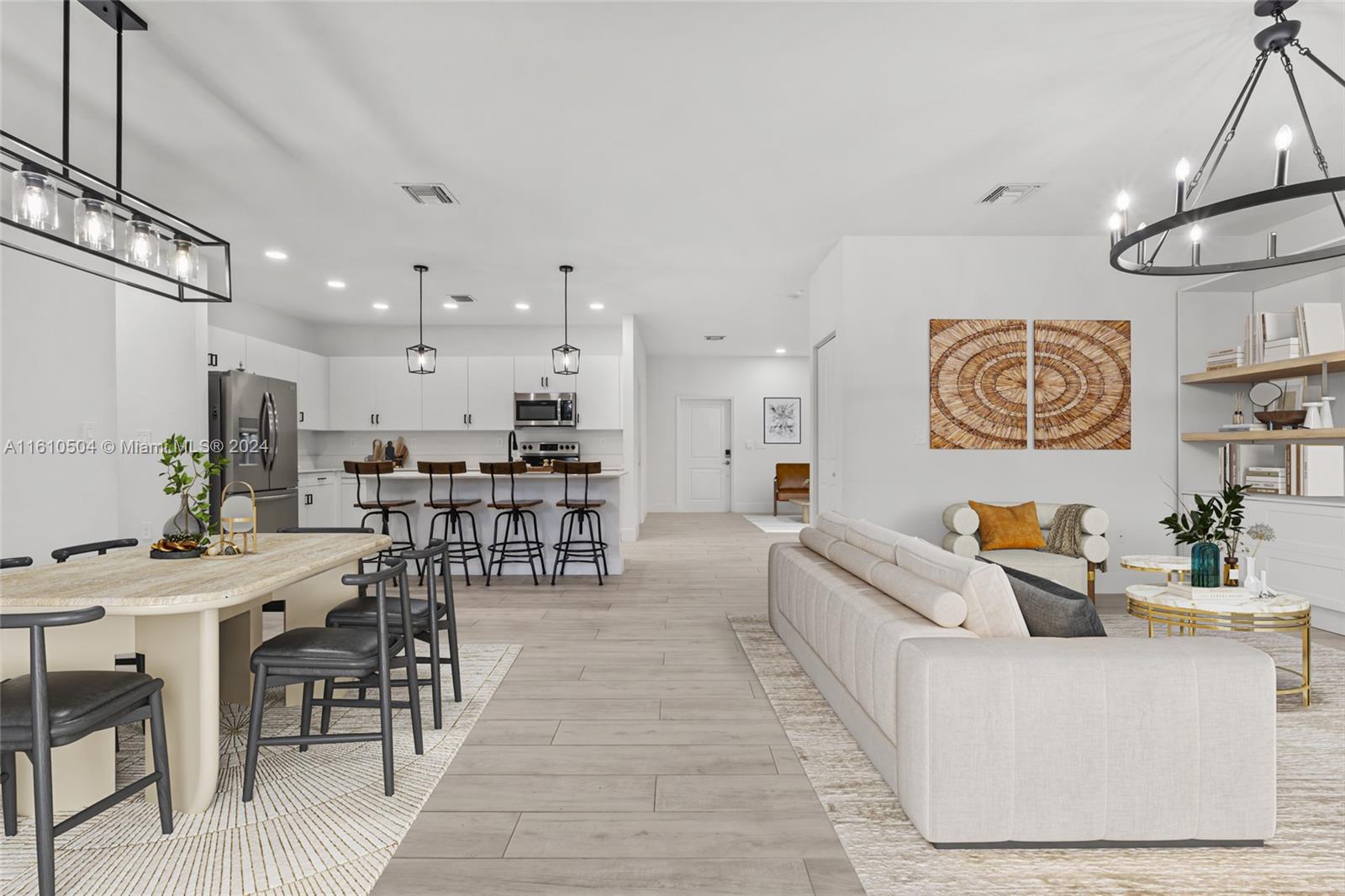 12743 Southwest 211th Street Miami, FL 33177 - Photo 5 of 38 a living room with furniture and view of kitchen