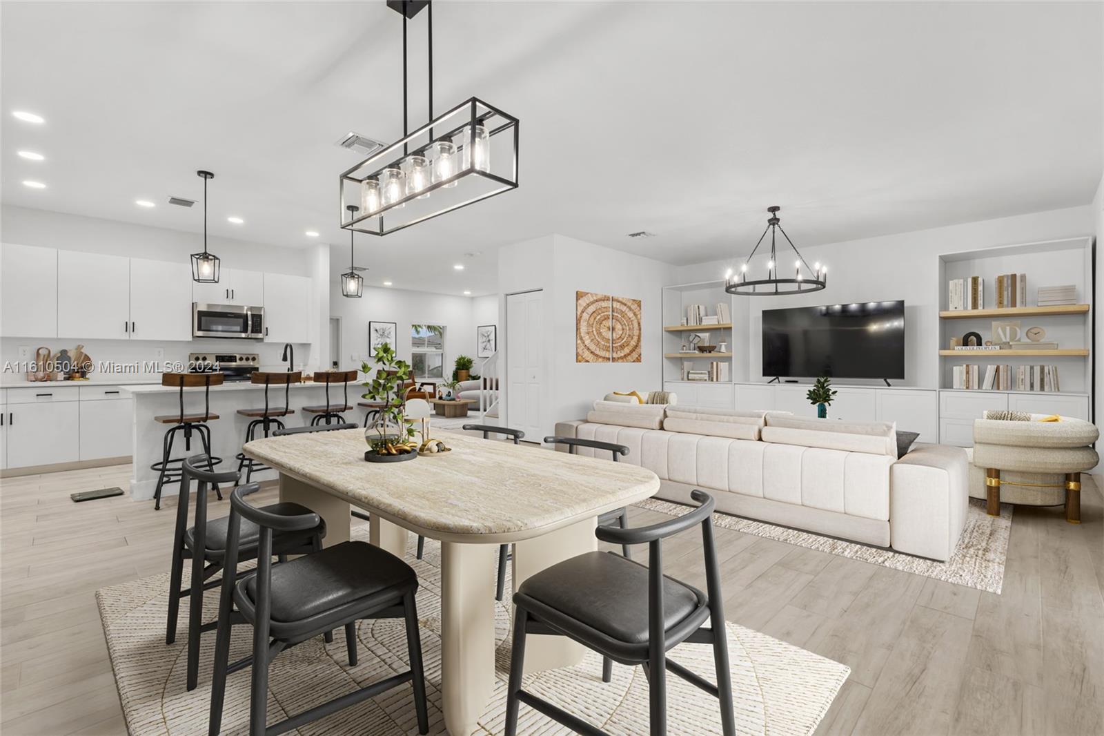 12743 Southwest 211th Street Miami, FL 33177 - Photo 6 of 38 a view of a dining room with furniture and wooden floor