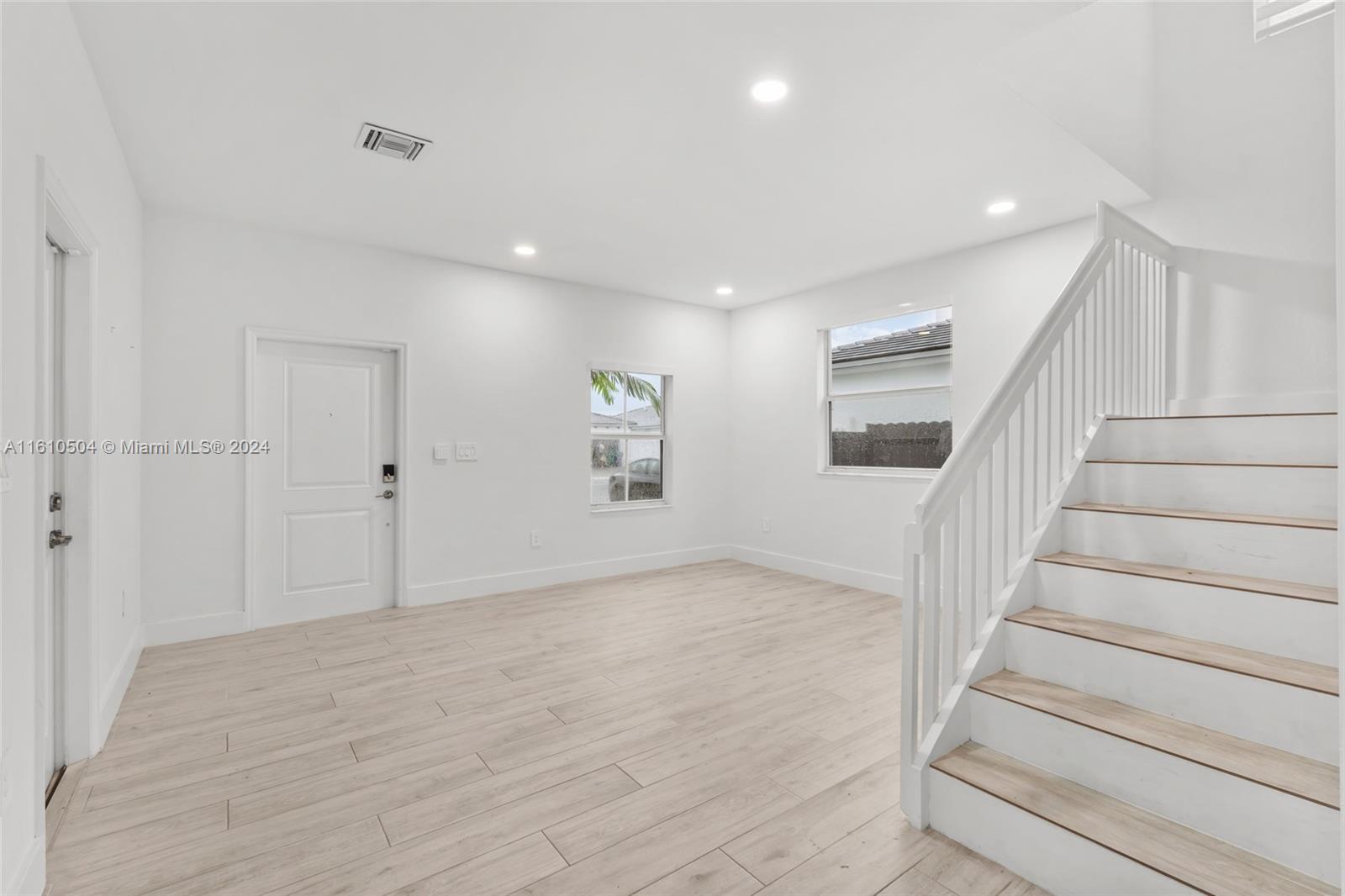 12743 Southwest 211th Street Miami, FL 33177 - Photo 10 of 38 a view of an entryway with wooden floor