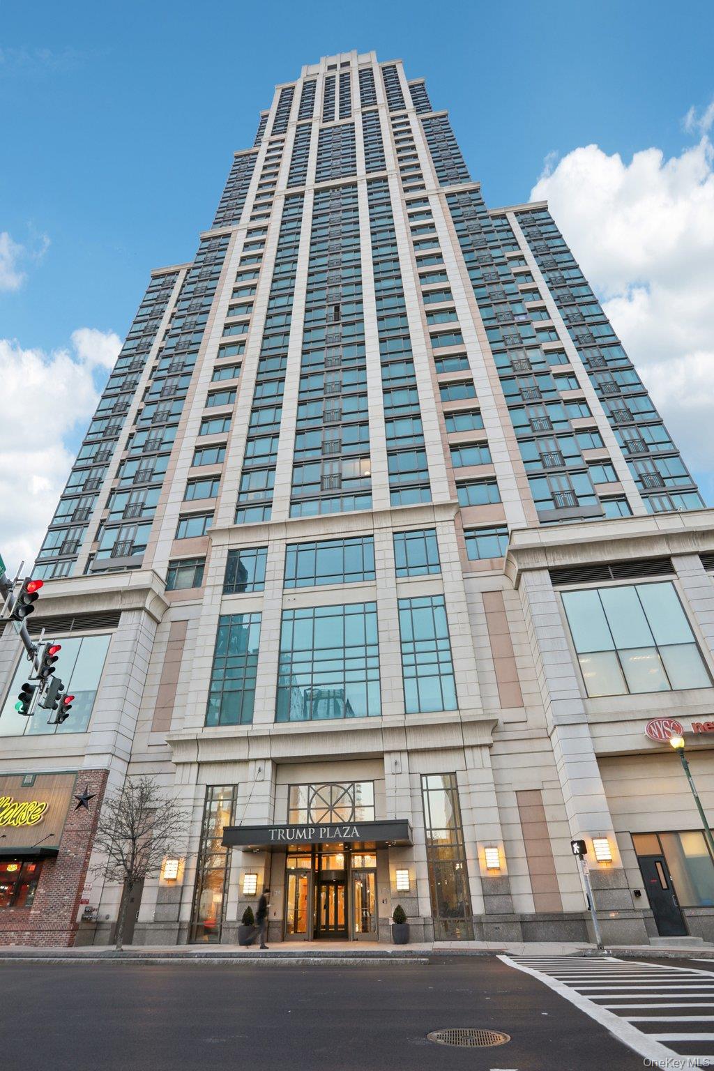 175 Huguenot Street, Unit 2403 New Rochelle, NY 10801 - Photo 1 of 30 front view of a building