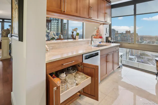 a kitchen with stainless steel appliances granite countertop a refrigerator and a stove