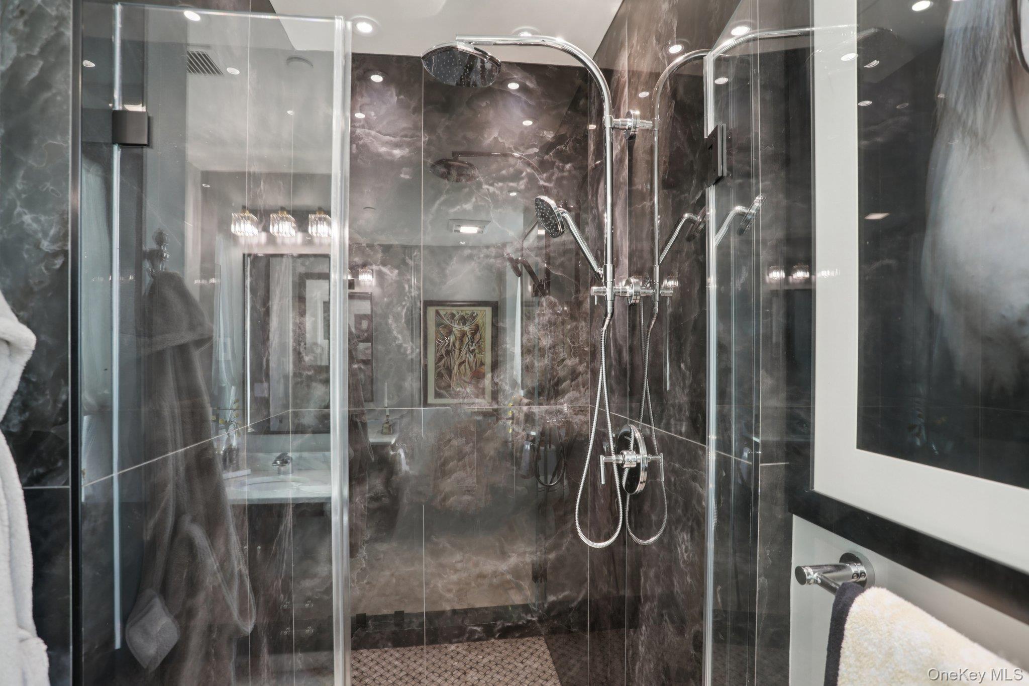 175 Huguenot Street, Unit 2403 New Rochelle, NY 10801 - Photo 24 of 30 a bathroom with a glass shower door