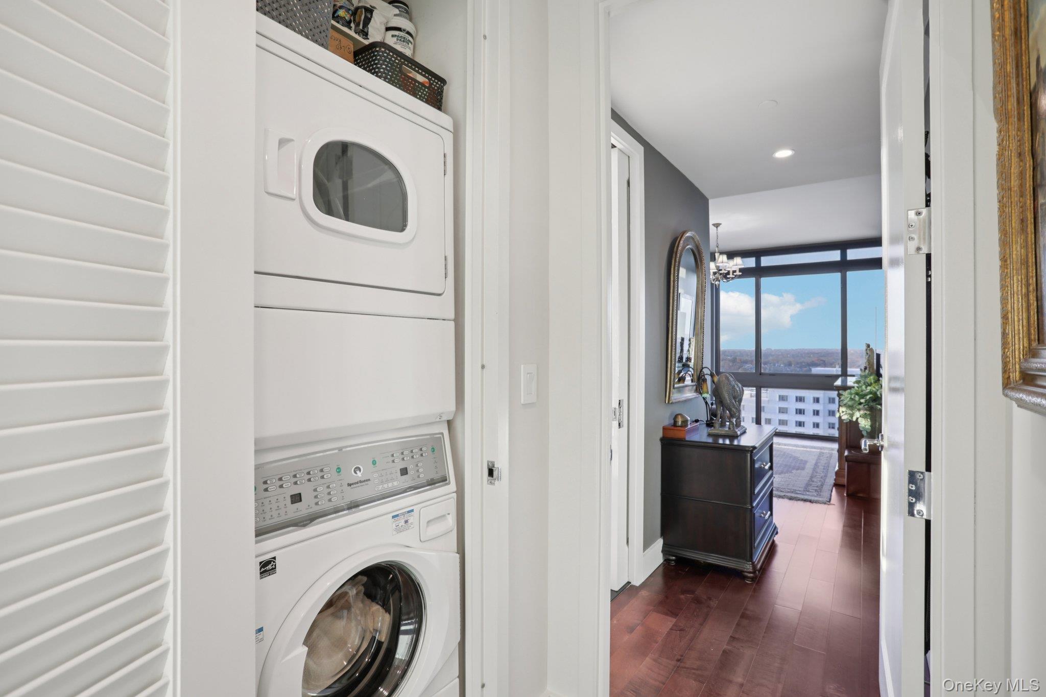 175 Huguenot Street, Unit 2403 New Rochelle, NY 10801 - Photo 25 of 30 a view of a hallway with washer and dryer