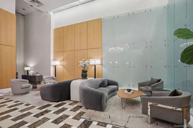 a living room with furniture a table and chairs