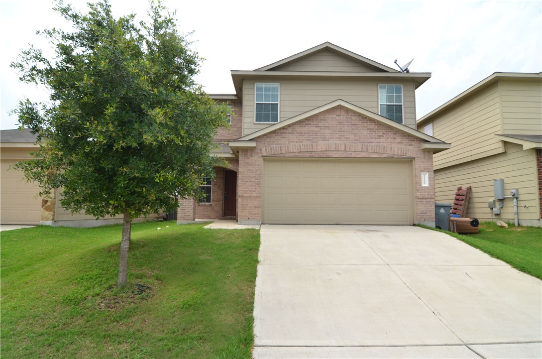11300 Ashbrook Drive Manchaca, TX 78652 - Photo 1 of 1 a front view of a house with a yard
