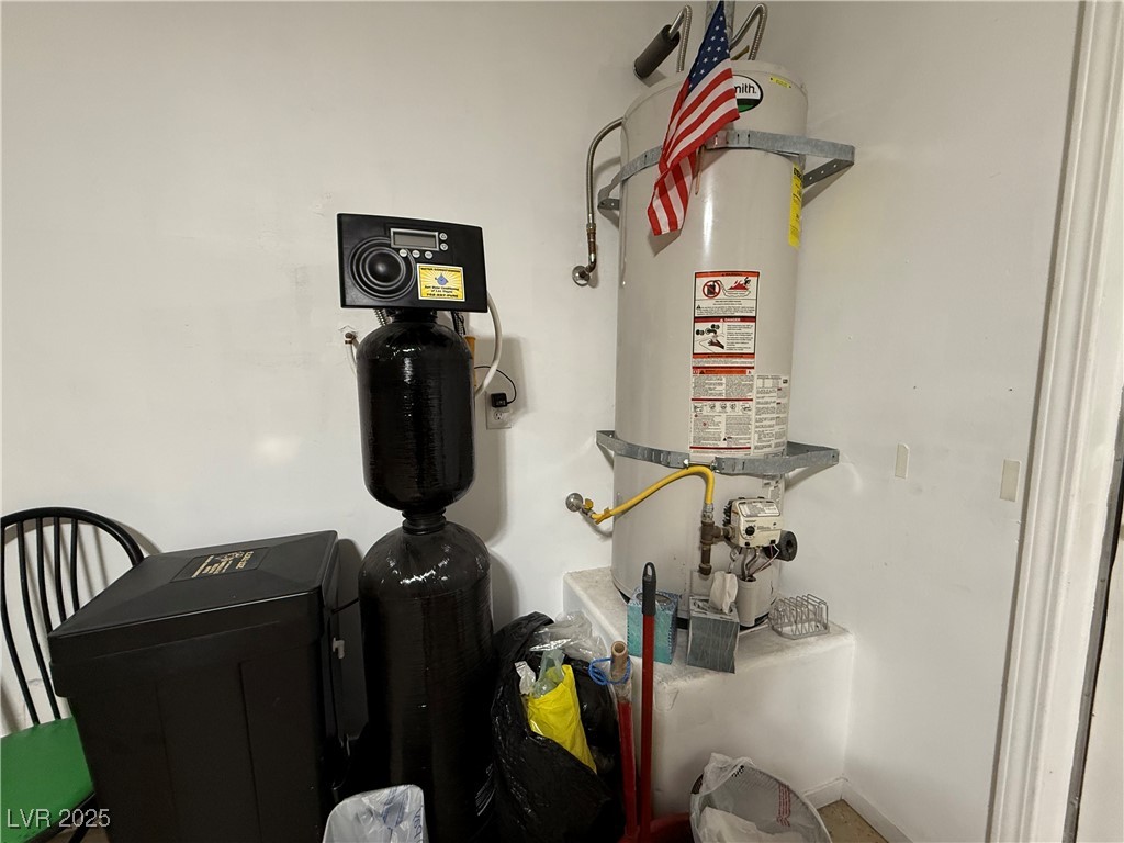 7062 Russell Ranch Avenue Las Vegas, NV 89113 - Photo 32 of 32 Utility room with strapped water heater and water softener