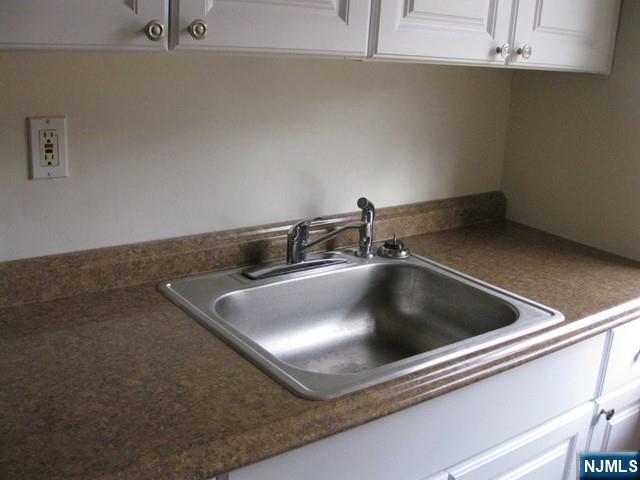 2-8 New Street, Unit 8A Tenafly, NJ 07670 - Photo 11 of 29 a close view of sink a faucet and appliance in the kitchen
