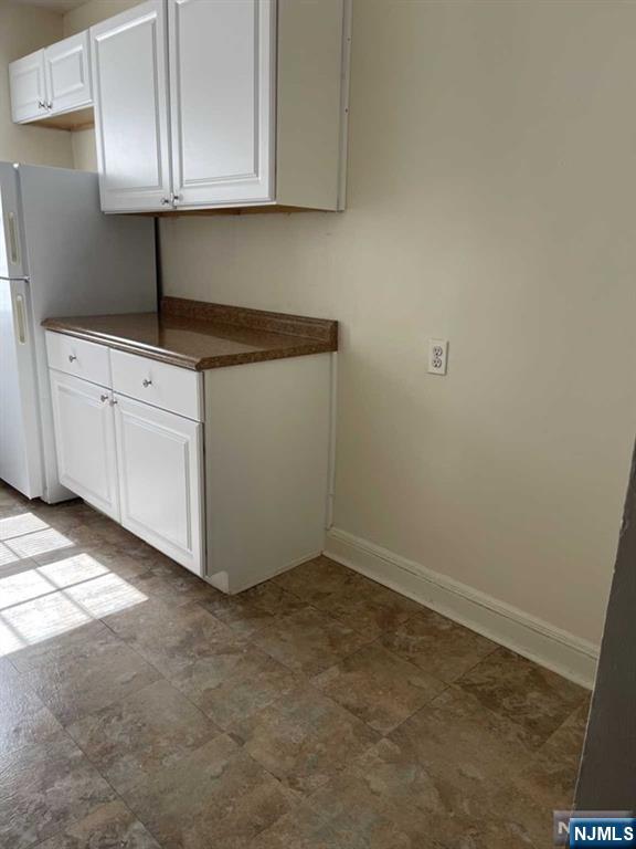 2-8 New Street, Unit 8A Tenafly, NJ 07670 - Photo 12 of 29 a kitchen with white cabinets