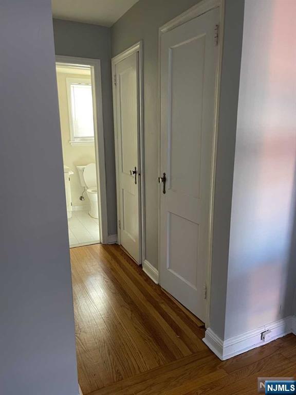 2-8 New Street, Unit 8A Tenafly, NJ 07670 - Photo 16 of 29 a view of a hallway with wooden floor