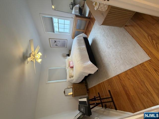 2-8 New Street, Unit 8A Tenafly, NJ 07670 - Photo 17 of 29 a bedroom with a bed a couch and dresser