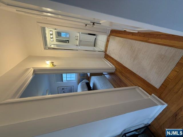 2-8 New Street, Unit 8A Tenafly, NJ 07670 - Photo 21 of 29 a view of a hallway and a livingroom with furniture