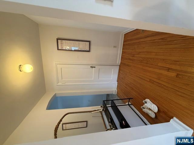 2-8 New Street, Unit 8A Tenafly, NJ 07670 - Photo 4 of 29 a view of room with wooden floor and white walls